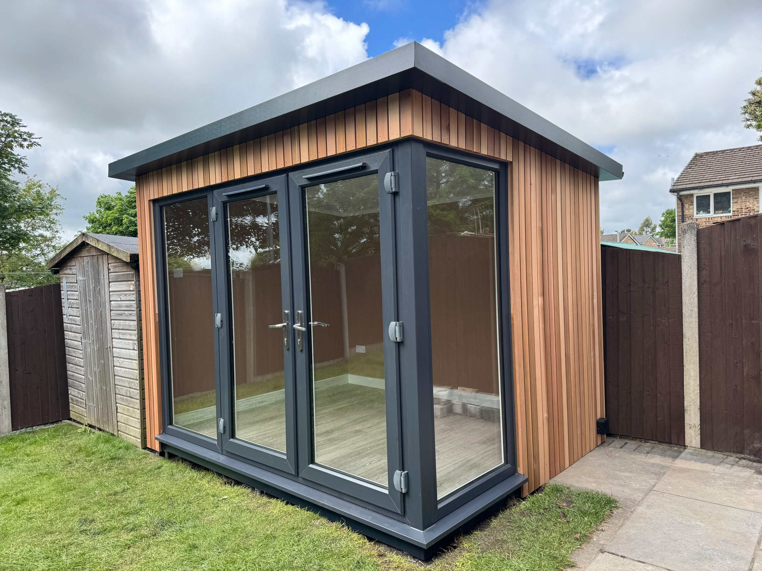 3m x 2.4m contemporary overhang with french doors and fixed glazing