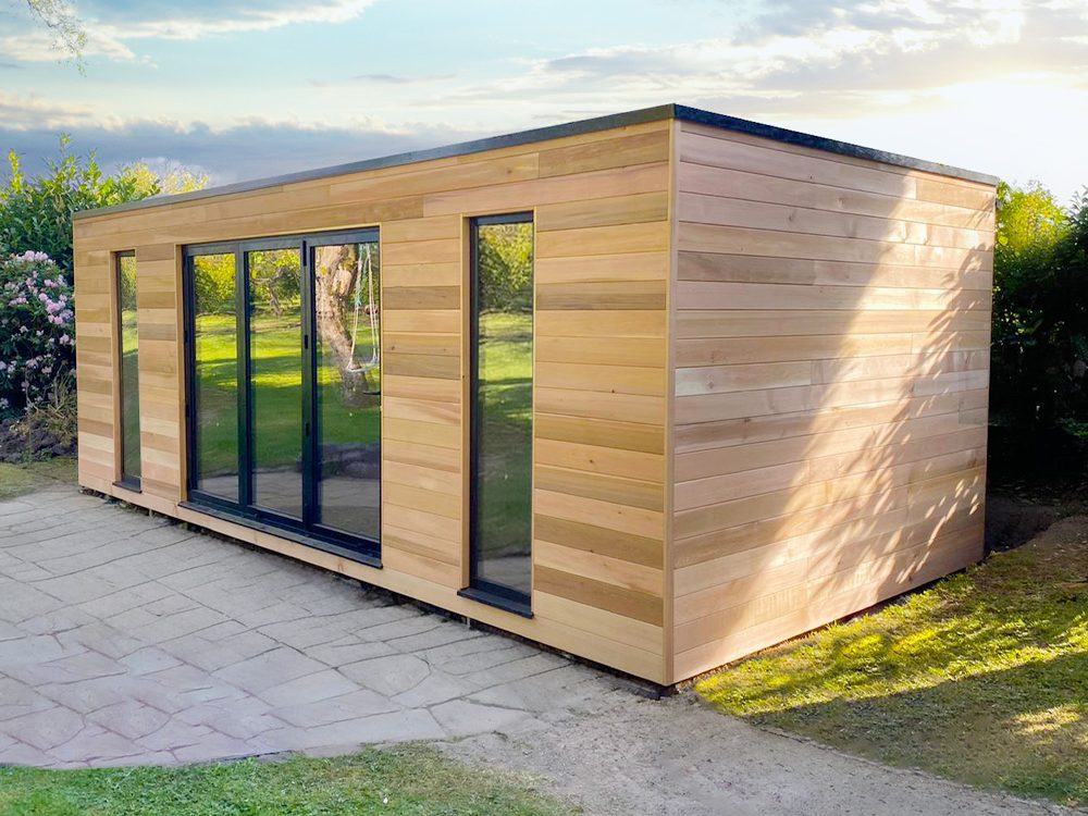 7.2 x 3.5m bespoke cubed studio with horizontal western red cedar, aluminium bifolding doors and fixed full height windows