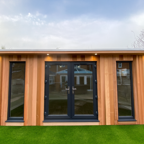 Bespoke overhang with inset lights, French doors and additional fixed full height windows