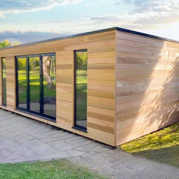 7.2 x 3.5m bespoke cubed studio with horizontal western red cedar, aluminium bifolding doors and fixed full height windows