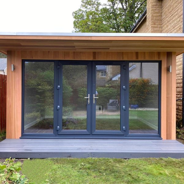 bespoke 1m overhang with french doors, side lights, light oak laminate flooring and outside lights