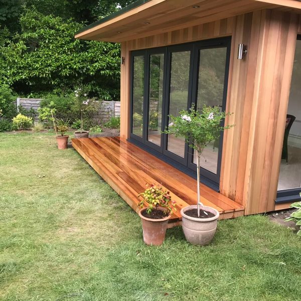 4.2m x 3m bespoke overhang with aluminium bifolding doors and outside lights