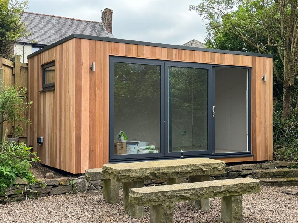 4.2m x 2.4m contemporary cubed with UPVC sliding doors, fixed full height window, letterbox window and outside lights