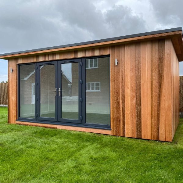 5.4m x 3m bespoke overhang with PVC french doors offset to the left, melamine interior and light oak flooring